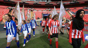 Elthorne High School representing Brentford and Northfield School & Sports College representing Hartlepool make their way out for the Kinder+Sport Football League Girls Cup final